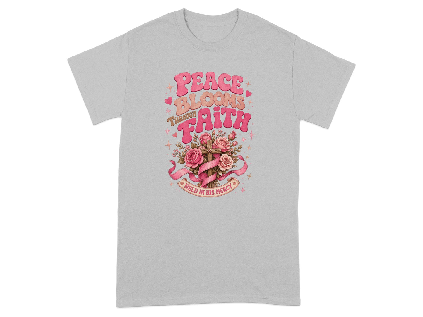 Graphic t-shirt with text "Peace Blooms Through Faith Held in His Mercy" and floral cross.