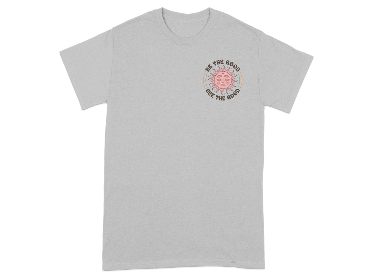 Grey t-shirt with a pastel sun graphic and text "Be the Good See the Good".