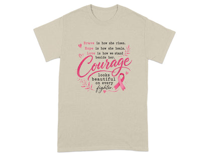 Tan t-shirt with text about bravery, hope, love, and courage featuring a pink ribbon.