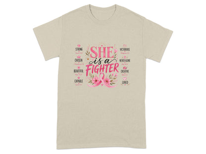 Light tan t-shirt with pink text "SHE is a FIGHTER" and inspirational words.