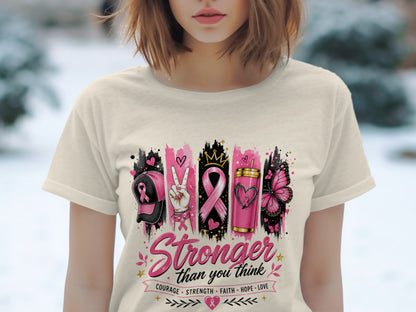 Cream t-shirt with "Stronger than you think" and breast cancer awareness icons.