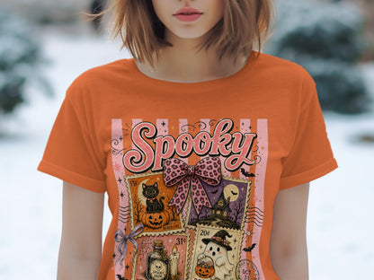 Orange t-shirt with "Spooky" text and four Halloween-themed postage stamps.