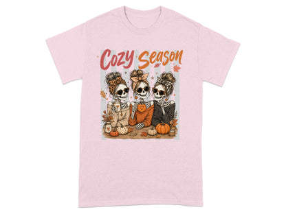 Three skeletons with messy buns and sunglasses hold drinks and pumpkins with "Cozy Season" text.