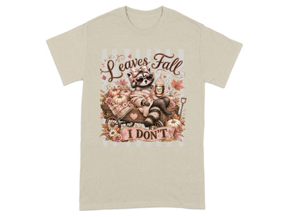 Raccoon with drink and pumpkins with text "Leaves Fall I DON'T".