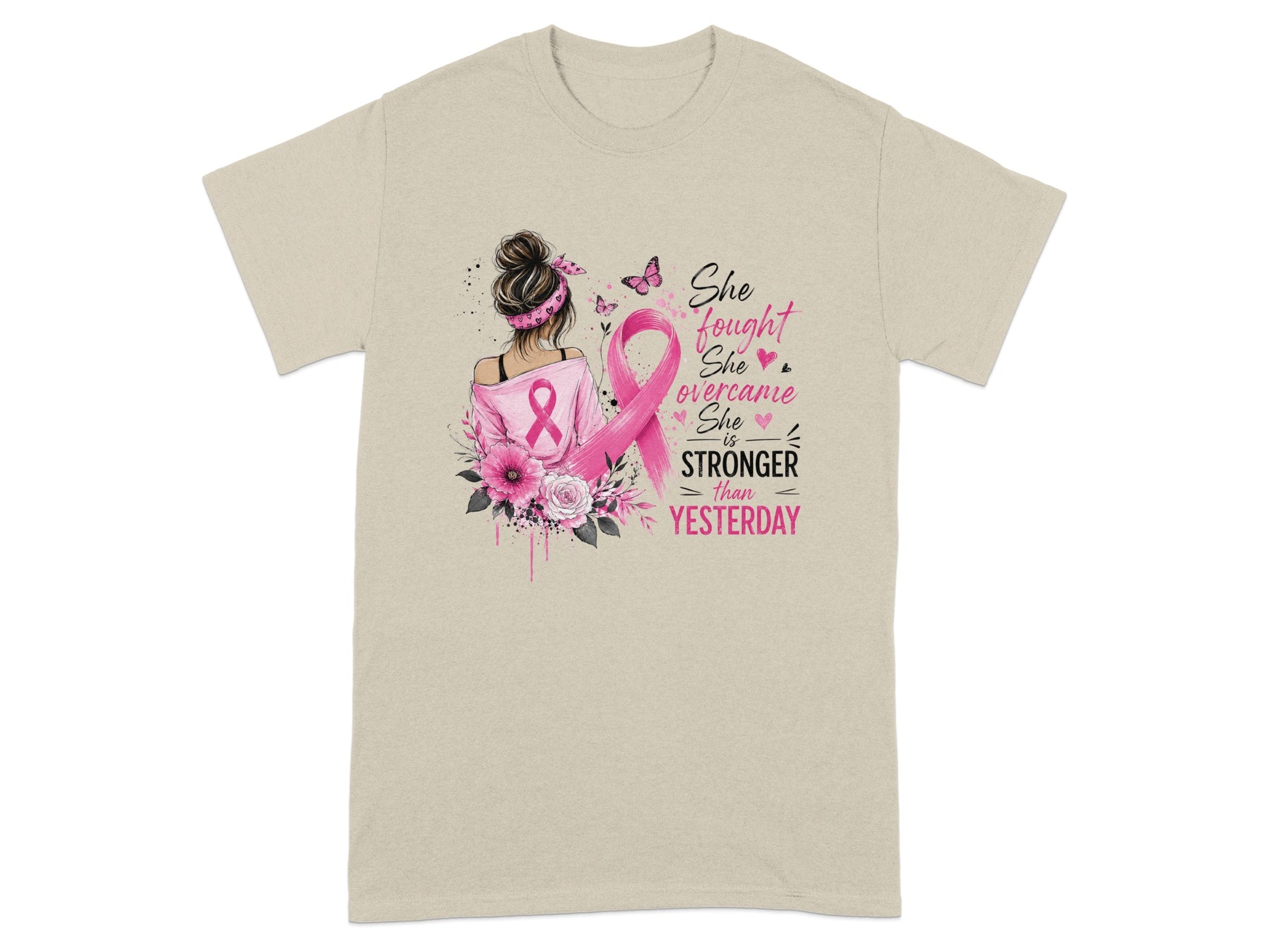 T-shirt with illustration of woman, pink ribbon, flowers, and text "She fought, She overcame, She is STRONGER than YESTERDAY."