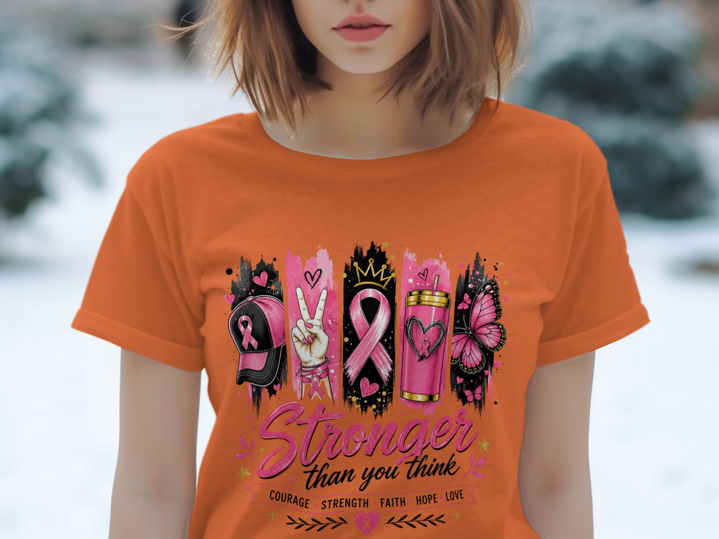 Orange t-shirt with "Stronger than you think" and breast cancer awareness icons.