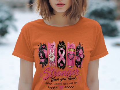 Orange t-shirt with "Stronger than you think" and breast cancer awareness icons.