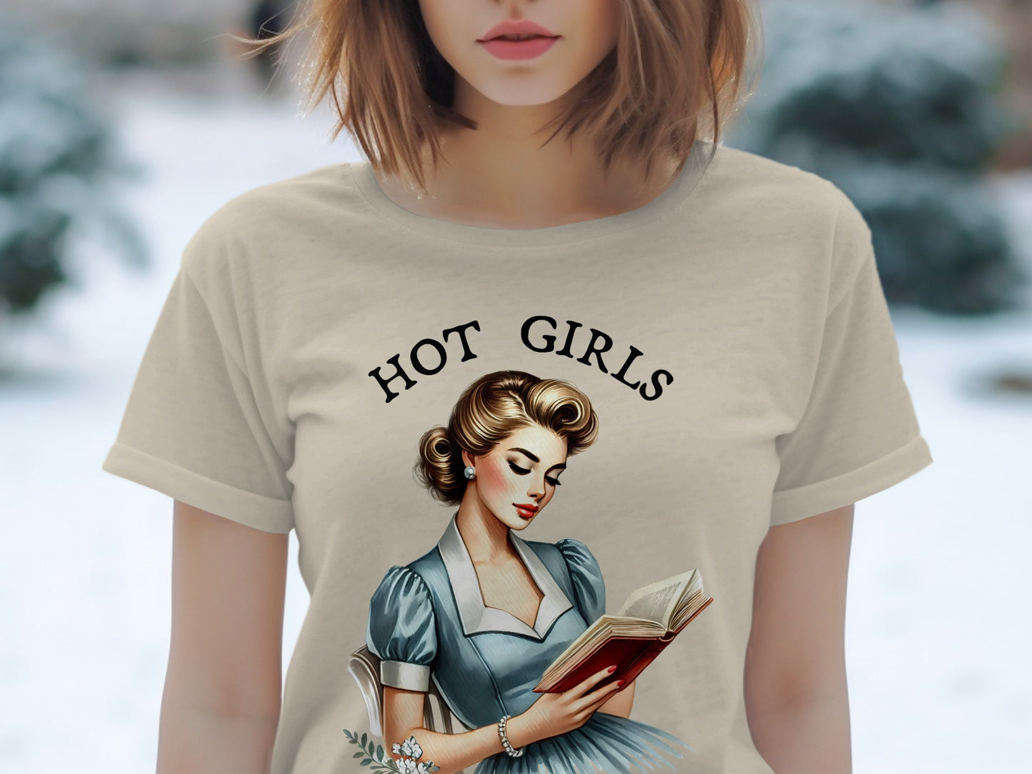 T-shirt with "Hot Girls" text and pin-up illustration of woman reading book.