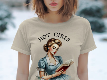 T-shirt with "Hot Girls" text and pin-up illustration of woman reading book.