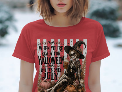 Skeleton witch holding drink with text "When you're ready for Halloween but it's only July".