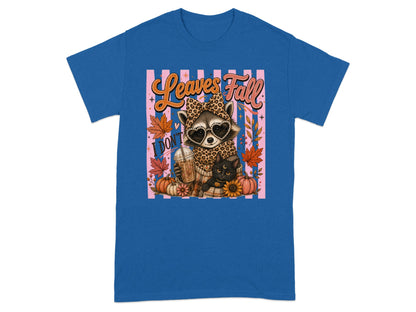 Raccoon and black cat with coffee and pumpkins, text "Leaves Fall".