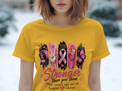 Yellow t-shirt with breast cancer awareness graphic and text.