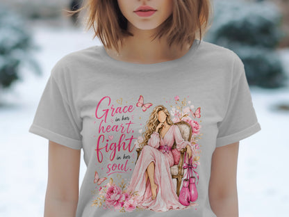 Woman in a pink dress with "Grace in her heart, fight in her soul" text and boxing gloves.