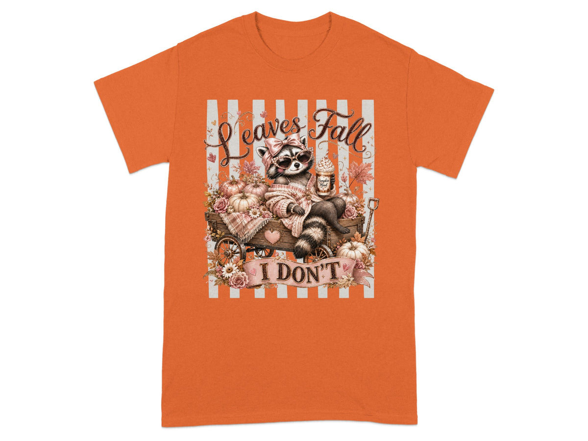 Cute raccoon with sunglasses and bow sits in autumn cart with pumpkins and text "Leaves Fall I Don't".