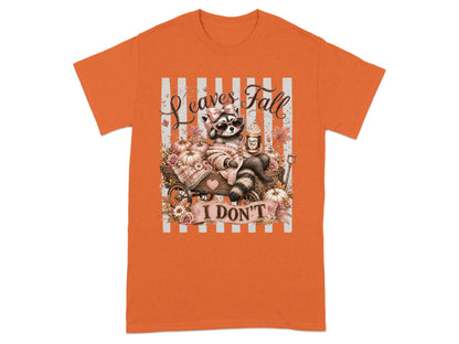 Cute raccoon with sunglasses and bow sits in autumn cart with pumpkins and text "Leaves Fall I Don't".