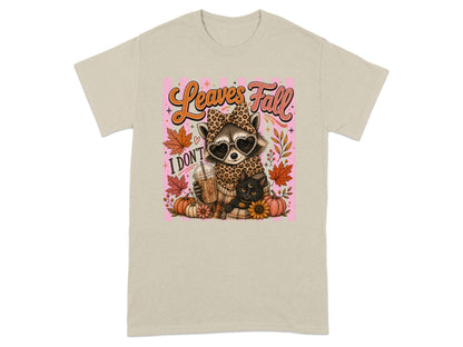 Raccoon in leopard print with heart sunglasses holding coffee; text "Leaves Fall I DON'T".