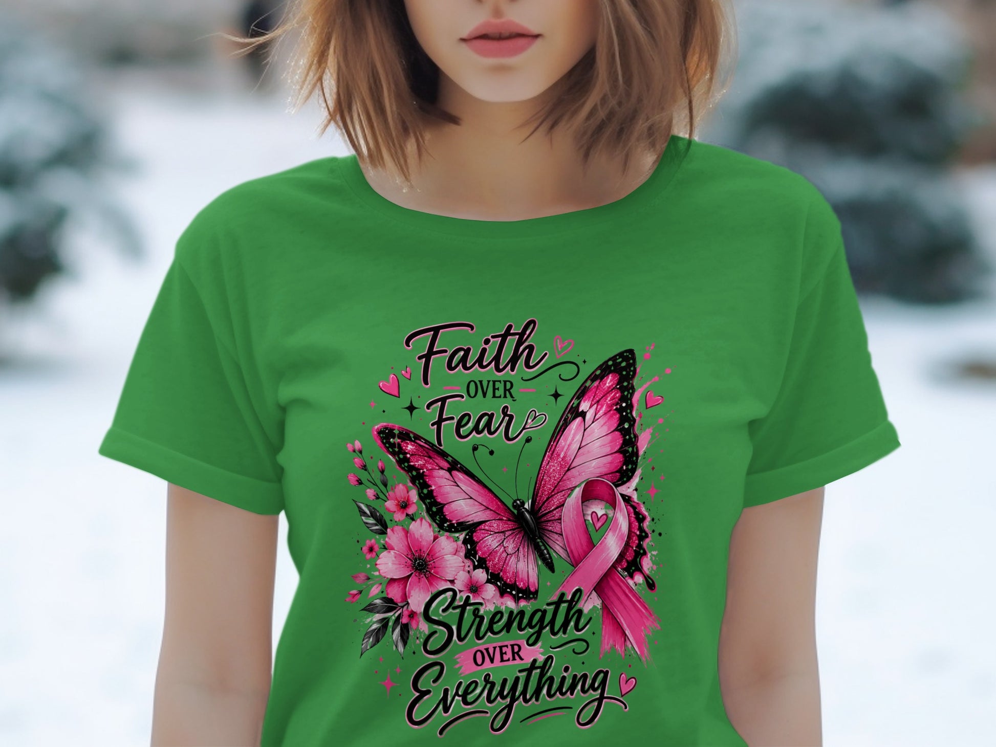 Green t-shirt with butterfly, flowers, and "Faith over Fear, Strength over Everything" text.