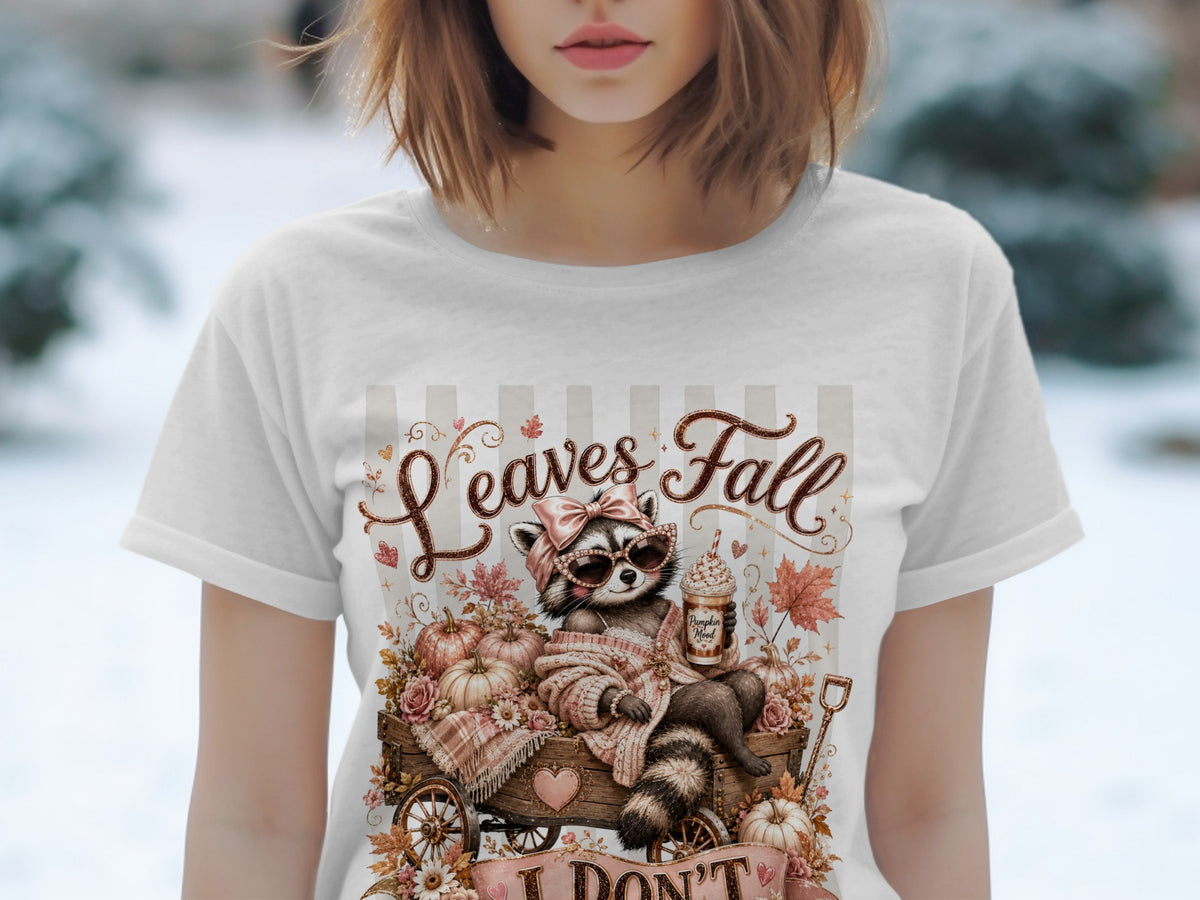 Raccoon in sunglasses with a latte on a cart, surrounded by pumpkins and leaves, text "Leaves Fall".