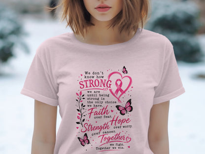 Pink t-shirt with breast cancer awareness text and graphics.