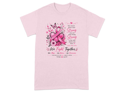 Pink t-shirt with breast cancer ribbon, hearts, flowers, butterfly, and text.