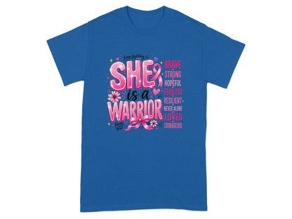 Blue t-shirt with "SHE is a WARRIOR" and inspirational words, including a pink ribbon.