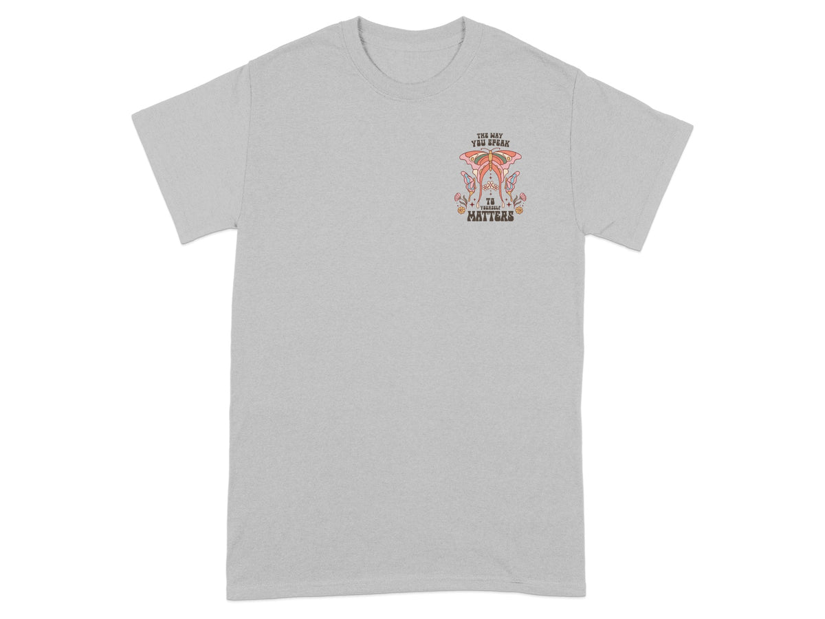 Grey t-shirt with retro butterfly graphic and text.