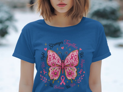 Blue t-shirt with butterfly design featuring pink ribbons, flowers, and text.