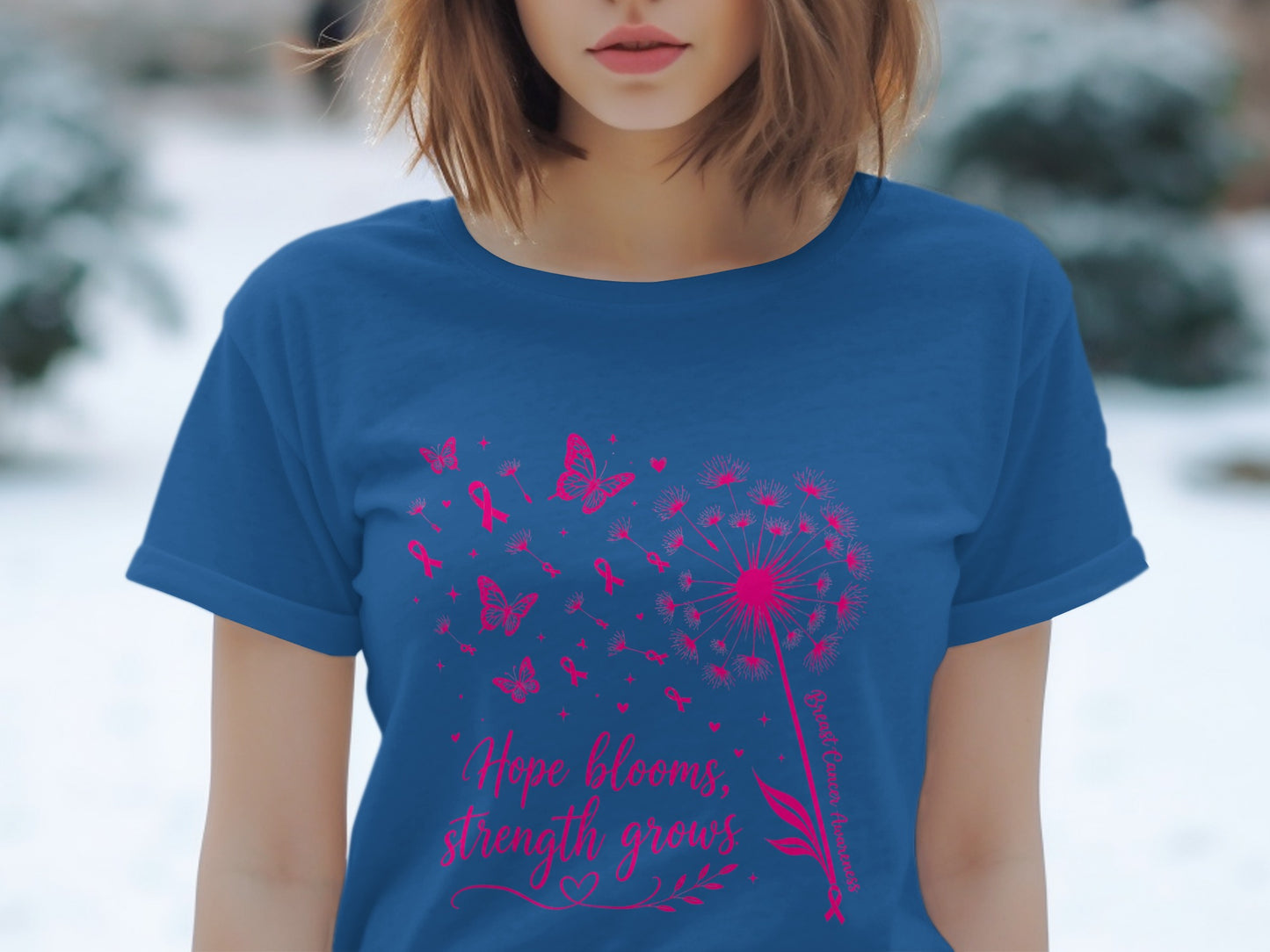 Blue t-shirt with pink dandelion, butterflies, ribbons, and text: "Hope blooms, strength grows."