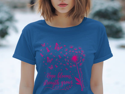 Blue t-shirt with pink dandelion, butterflies, ribbons, and text: "Hope blooms, strength grows."