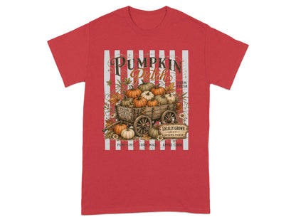"Pumpkin Patch" graphic with wagon of pumpkins and autumn text on a red t-shirt.
