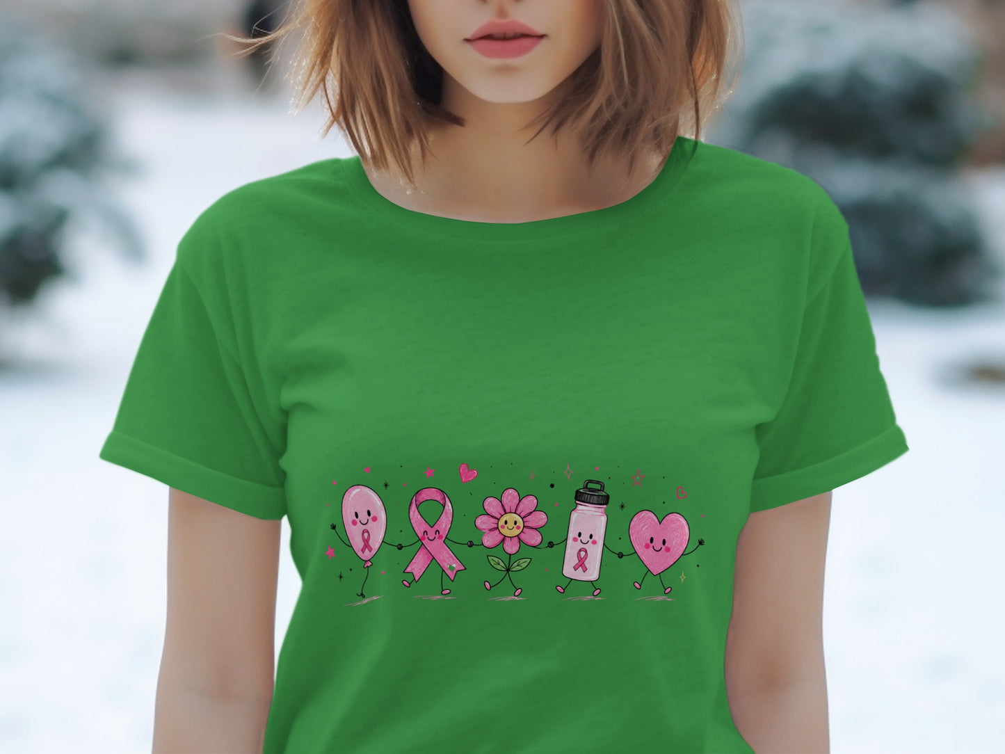 Green t-shirt with a row of cartoon characters including a balloon, ribbon, flower, water bottle, and heart.