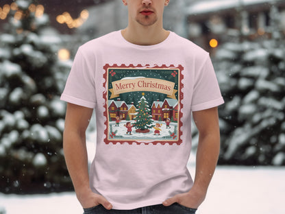 Light pink t-shirt with Merry Christmas postage stamp design featuring children around a tree.