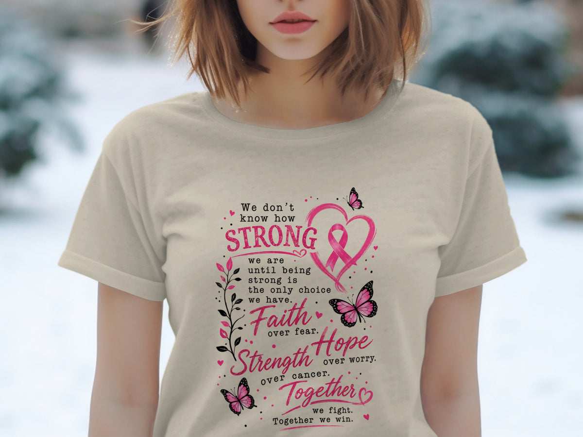Light beige t-shirt with breast cancer awareness text and pink ribbon.
