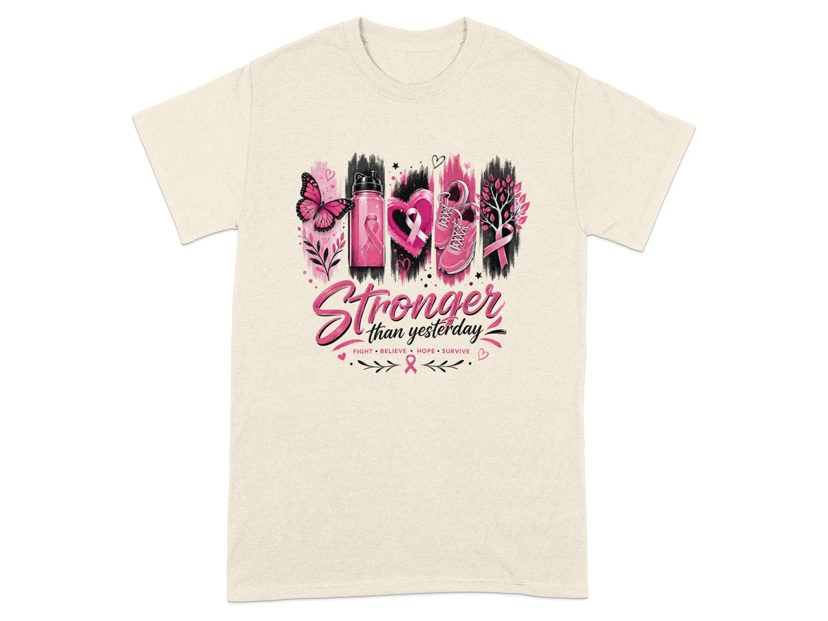 Cream t-shirt with "Stronger than yesterday" text and breast cancer awareness ribbon imagery.