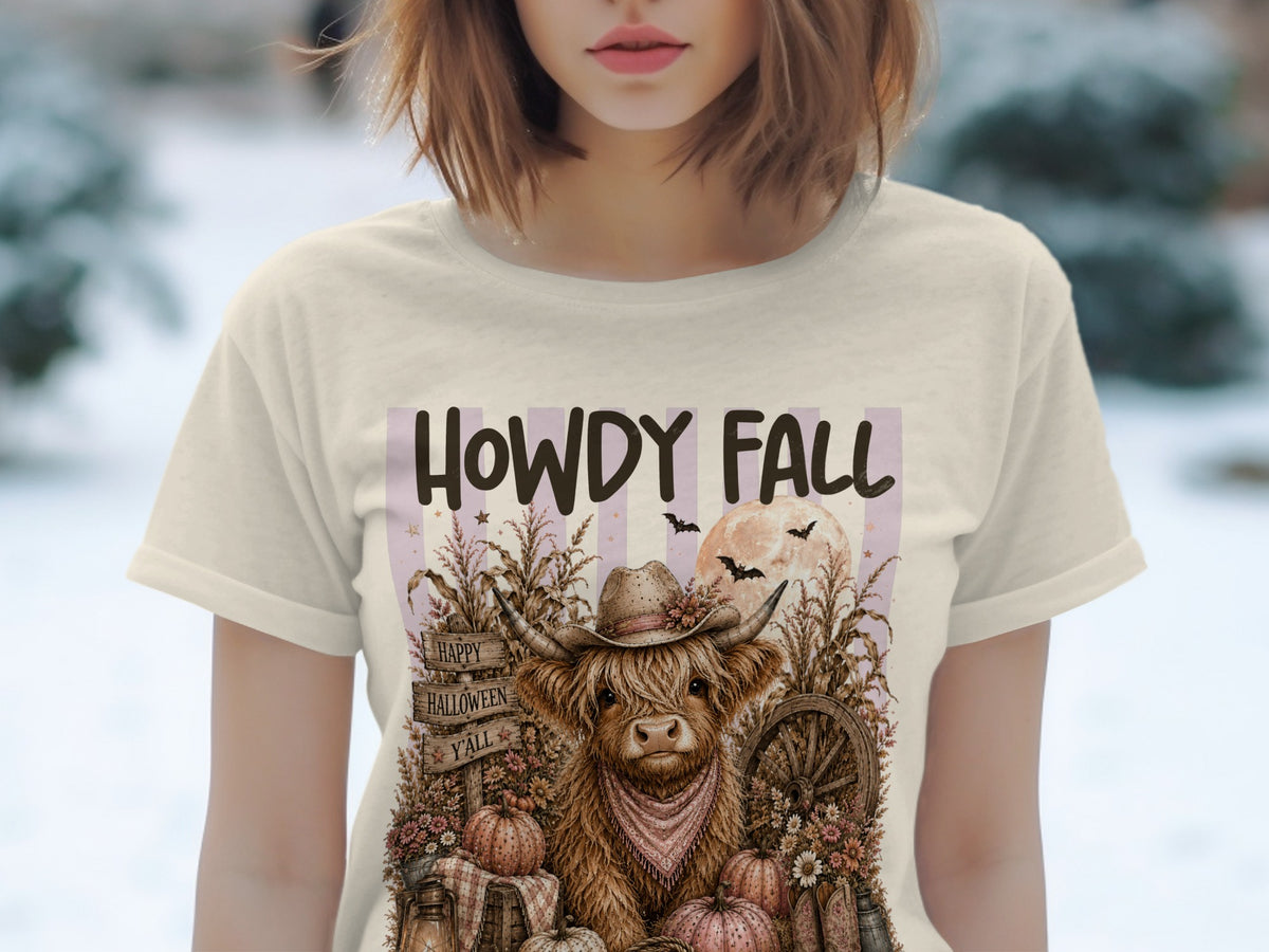 T-shirt graphic with "HOWDY FALL" text, a cow in a cowboy hat, pumpkins, and Halloween bats.