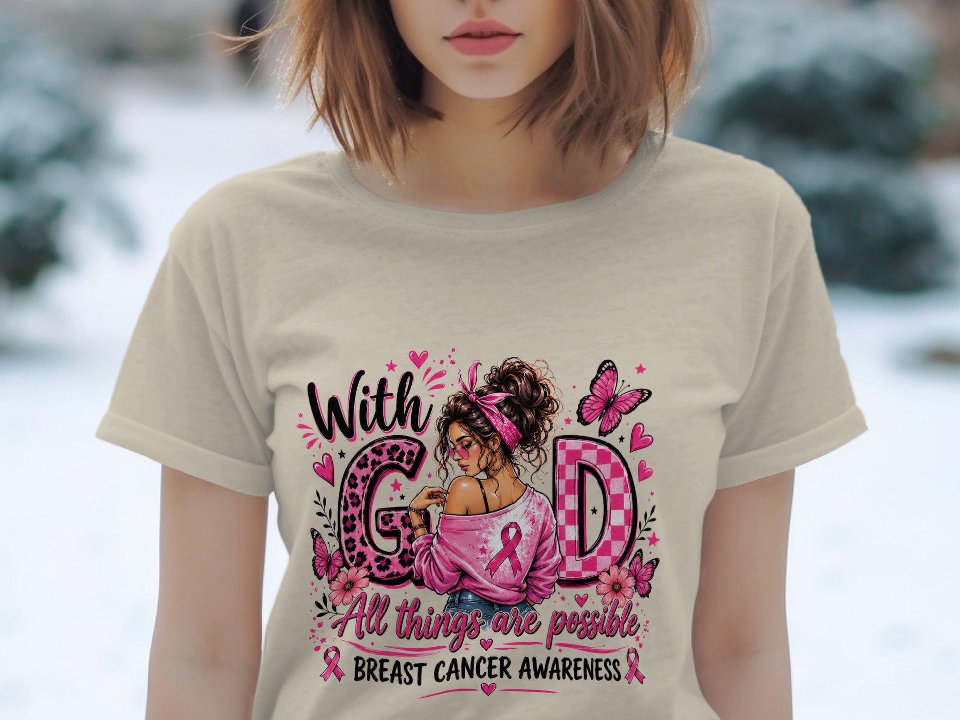 Shirt with "With GOD All things are possible" and breast cancer awareness graphics.