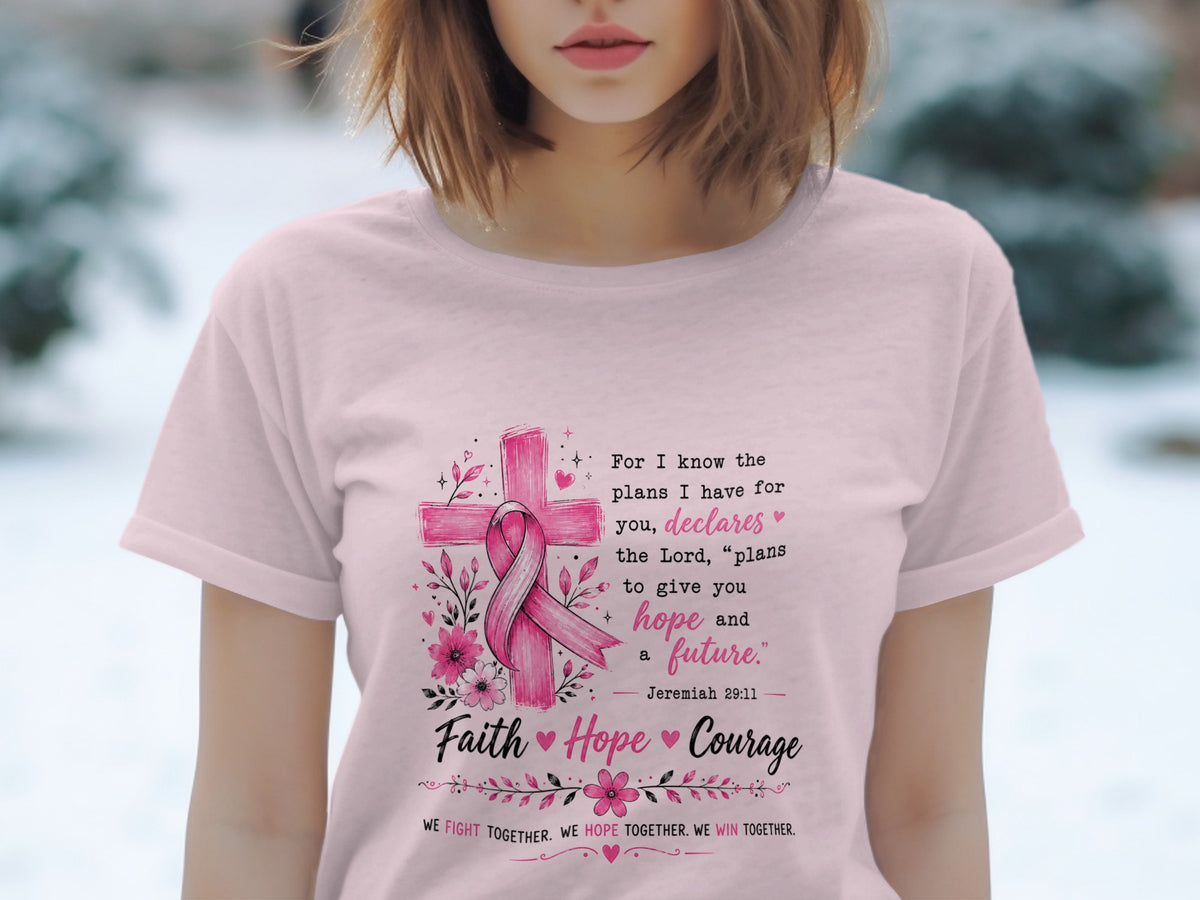 Pink t-shirt with cross, pink ribbon, flowers, and inspirational text.
