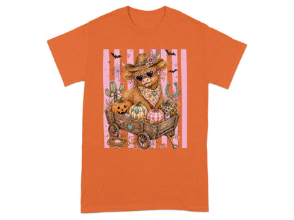 Highland cow in wagon with pumpkins, bats, and fall decorations.