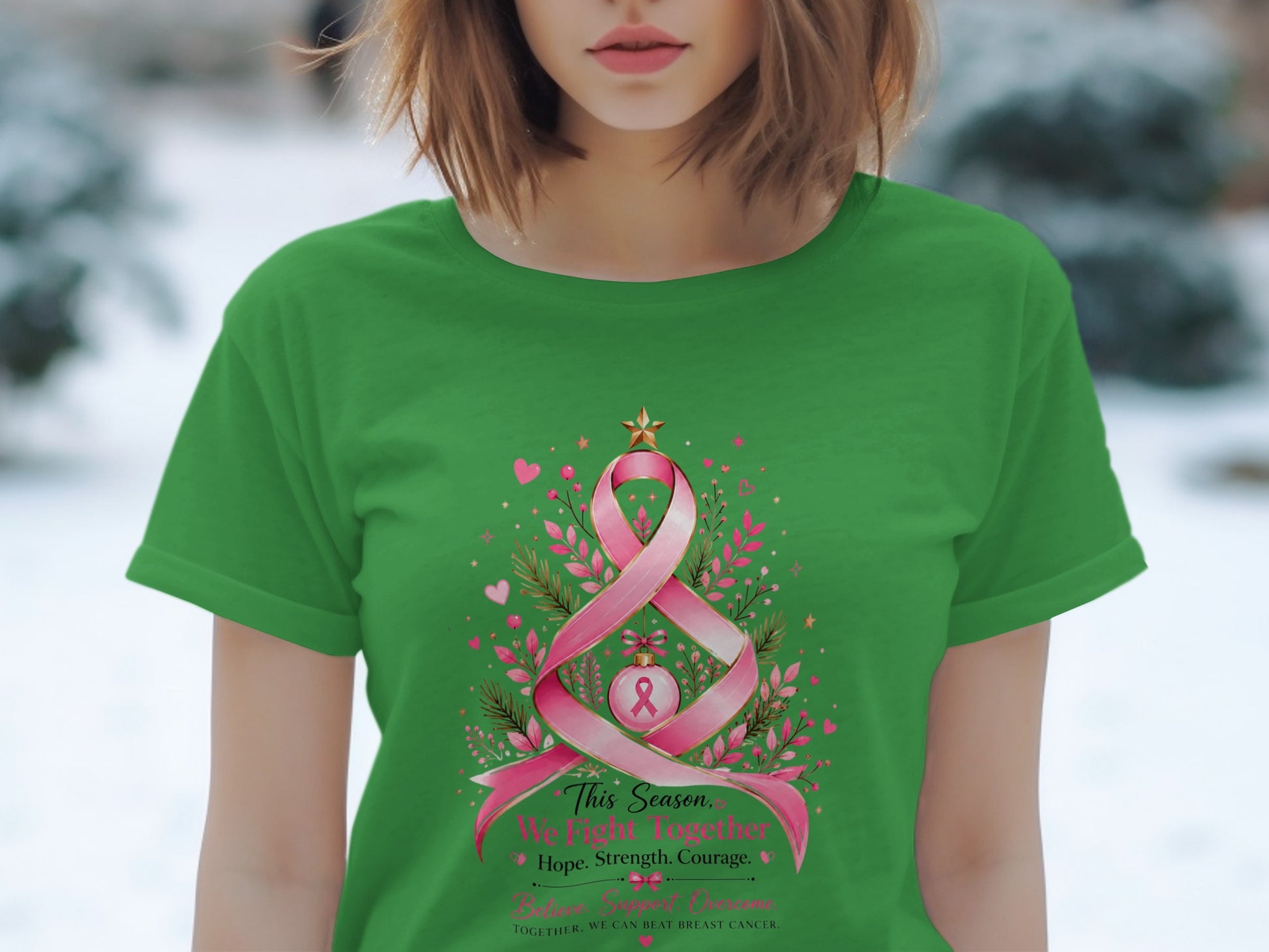 Green t-shirt with pink ribbon tree design and inspirational text.