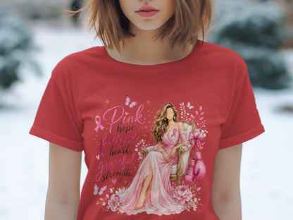 Red t-shirt with woman in pink dress, boxing gloves, and text "Pink hope, fierce heart, graceful strength."