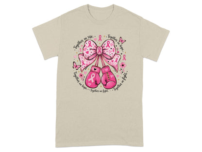 T-shirt with pink boxing gloves, bow, and breast cancer awareness ribbons.