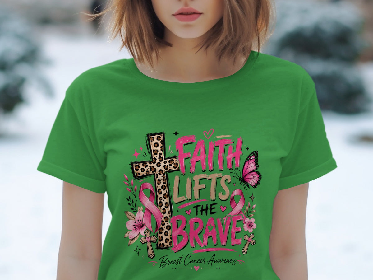 Green t-shirt with "Faith Lifts The Brave" text and breast cancer awareness symbols.