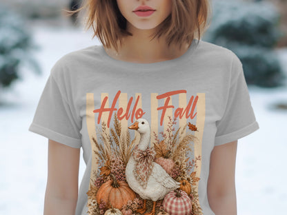 White goose with bow surrounded by pumpkins and fall foliage, text reads "Hello Fall."