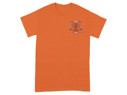 Orange t-shirt with floral design and text "You gotta keep going to keep growing."