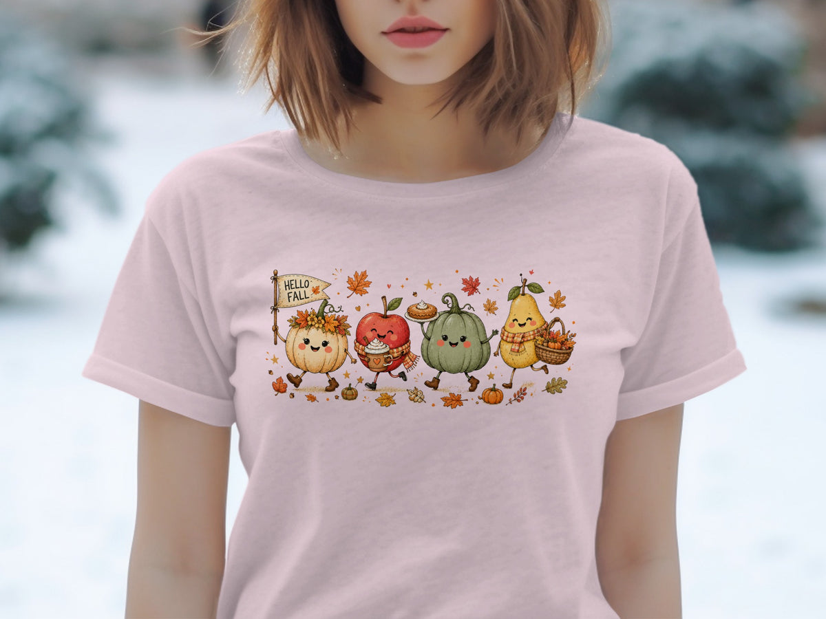 Cute autumn characters, including pumpkins, apple, and pear, on a pink t-shirt.
