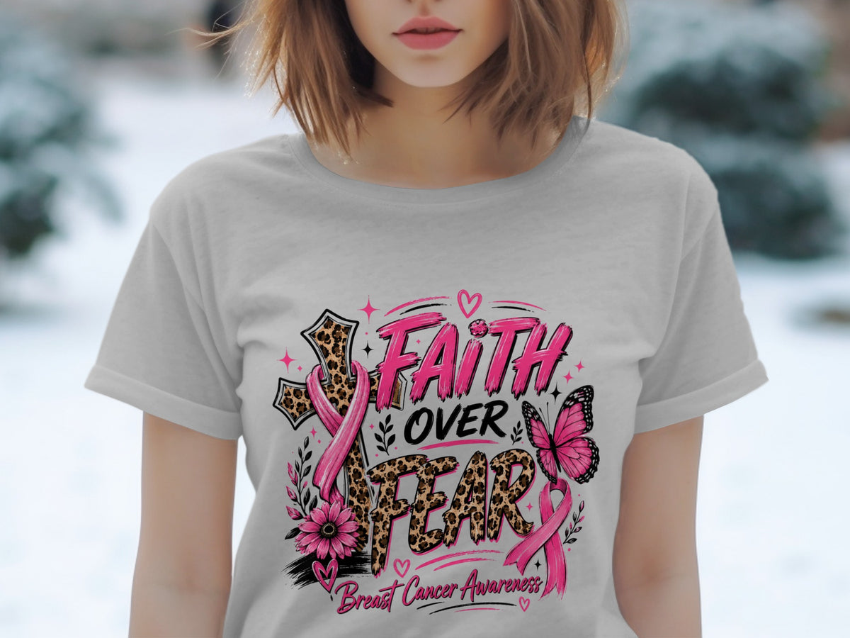 Pink ribbon Faith Over Fear Breast Cancer Awareness graphic on t-shirt.