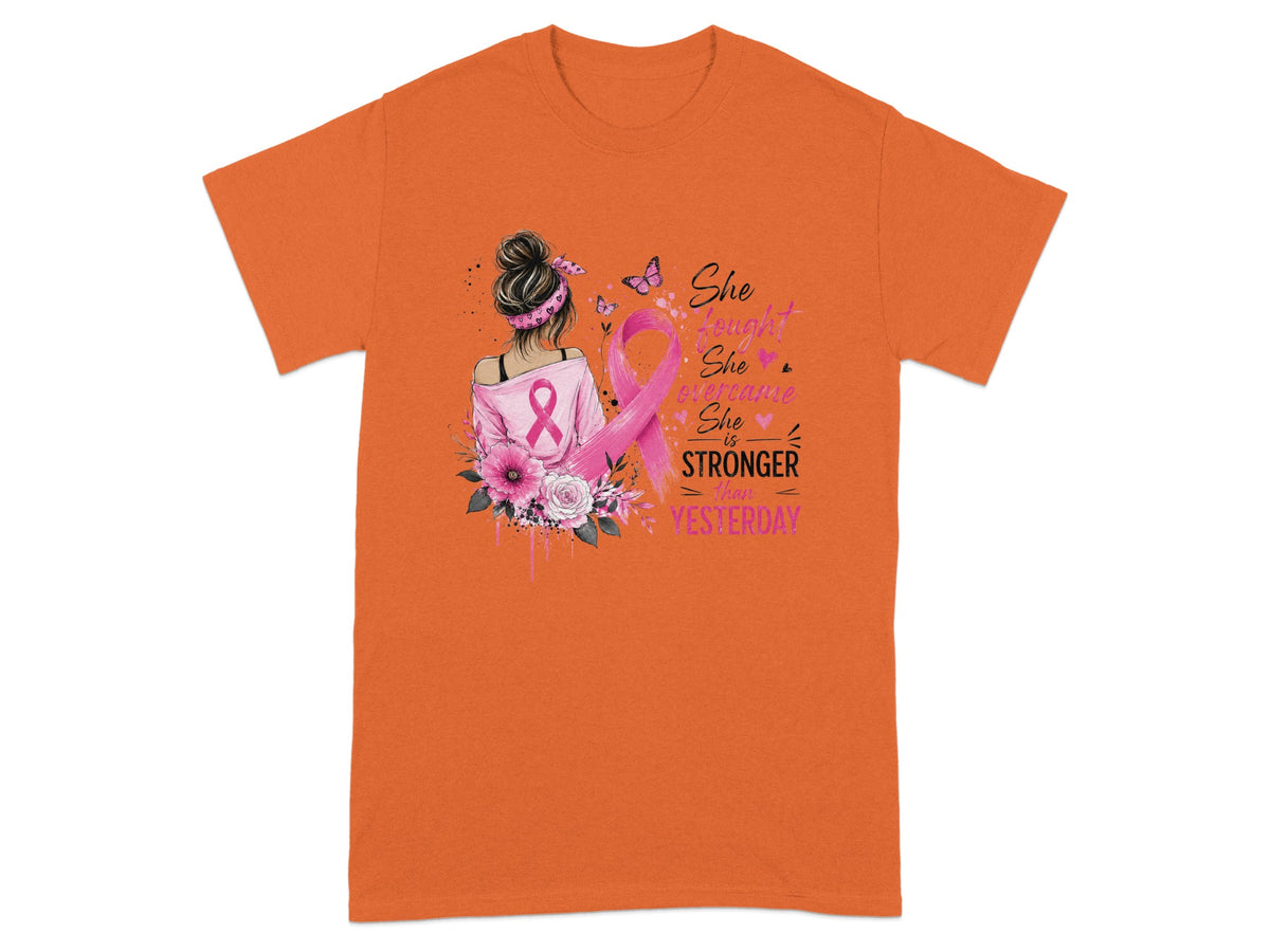 T-shirt with pink breast cancer ribbon, flowers, and text: "She fought, she overcame, she is stronger than yesterday."