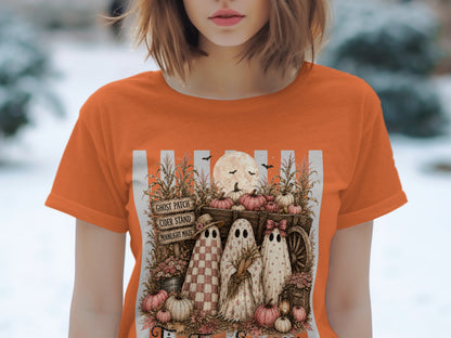 Halloween t-shirt design with three ghosts, pumpkins, and spooky text.