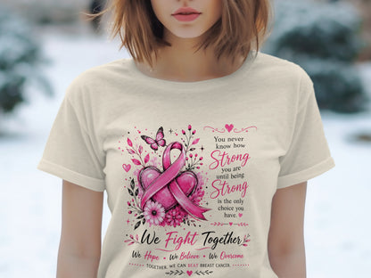 T-shirt with pink breast cancer ribbon, hearts, flowers, butterfly, and inspirational text.