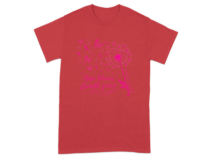 Red t-shirt with pink dandelion and butterflies graphic and text.